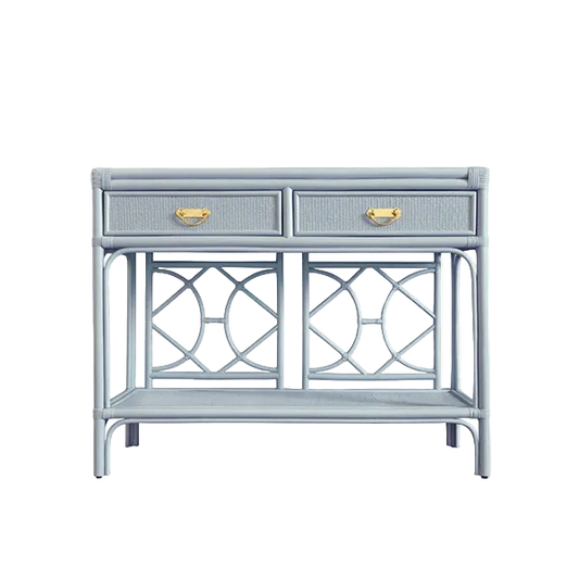 A light blue console table featuring two drawers with textured fronts and brass handles, supported by a geometric metal frame with an open lower shelf, set against a plain white background.